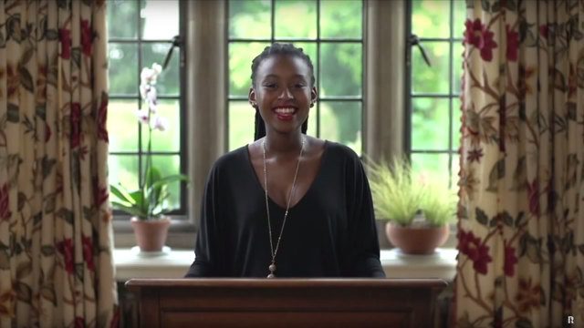 An image of Rhodes Scholar Kopano Mabaso standing at a lectern giving a speech.